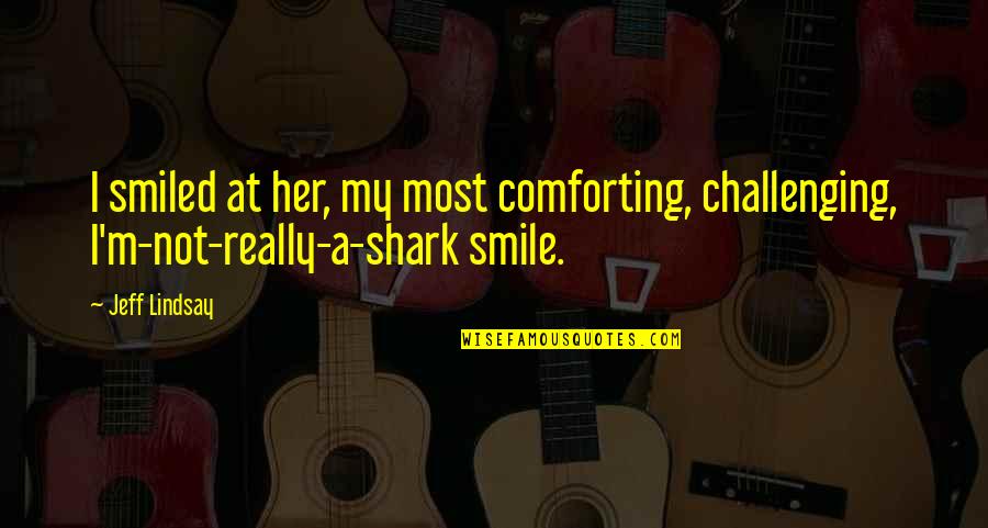 Darkly Dreaming Dexter Quotes By Jeff Lindsay: I smiled at her, my most comforting, challenging,