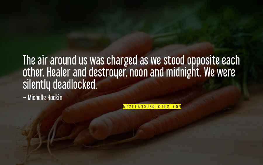 Deadlocked Quotes By Michelle Hodkin: The air around us was charged as we Deadlocked Quotes By Michelle Hodkin: The air around us was charged as we