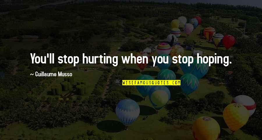 Dear Haters I Love You Quotes By Guillaume Musso: You'll stop hurting when you stop hoping.