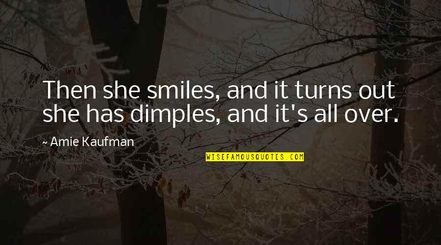 Dimples And Smiles Quotes By Amie Kaufman: Then she smiles, and it turns out she