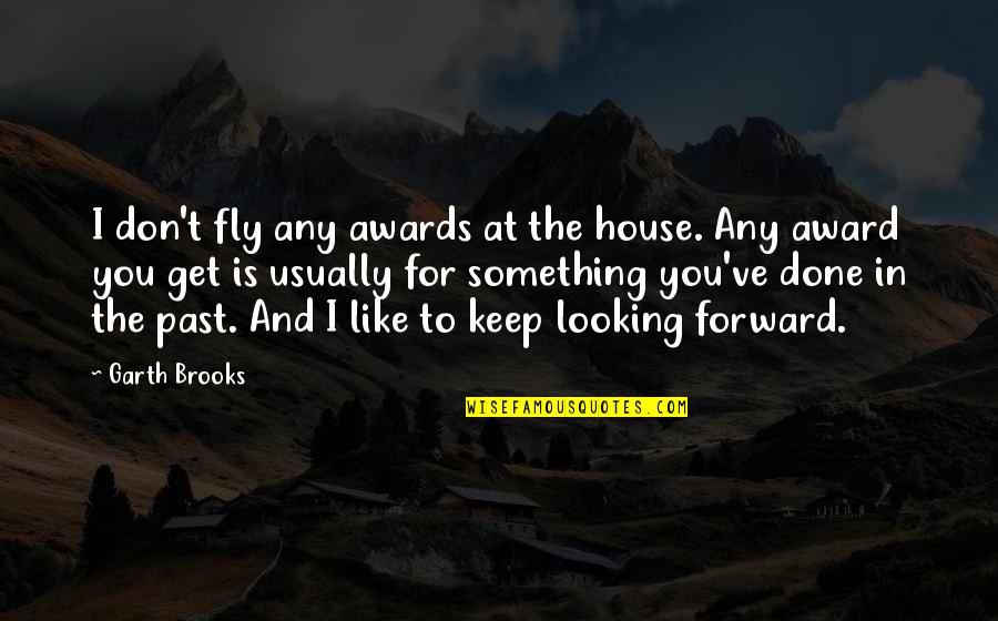 Done With My Past Quotes By Garth Brooks: I don't fly any awards at the house.