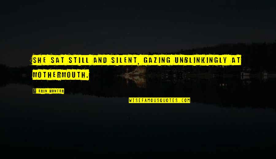 Example That Is In Quadruple Quotes By Erin Hunter: She sat still and silent, gazing unblinkingly at