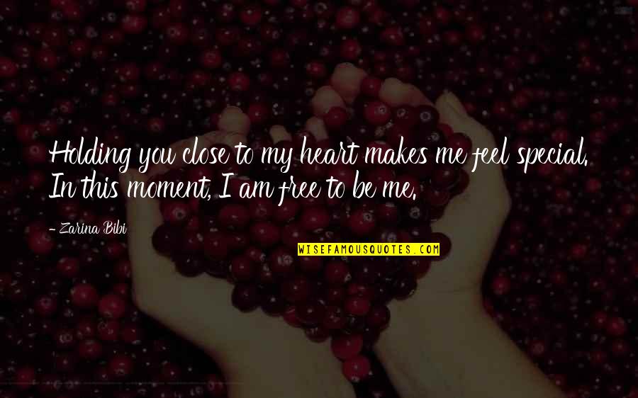 Feel This Moment Quotes By Zarina Bibi: Holding you close to my heart makes me