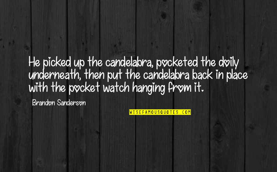 Fellated Quotes By Brandon Sanderson: He picked up the candelabra, pocketed the doily