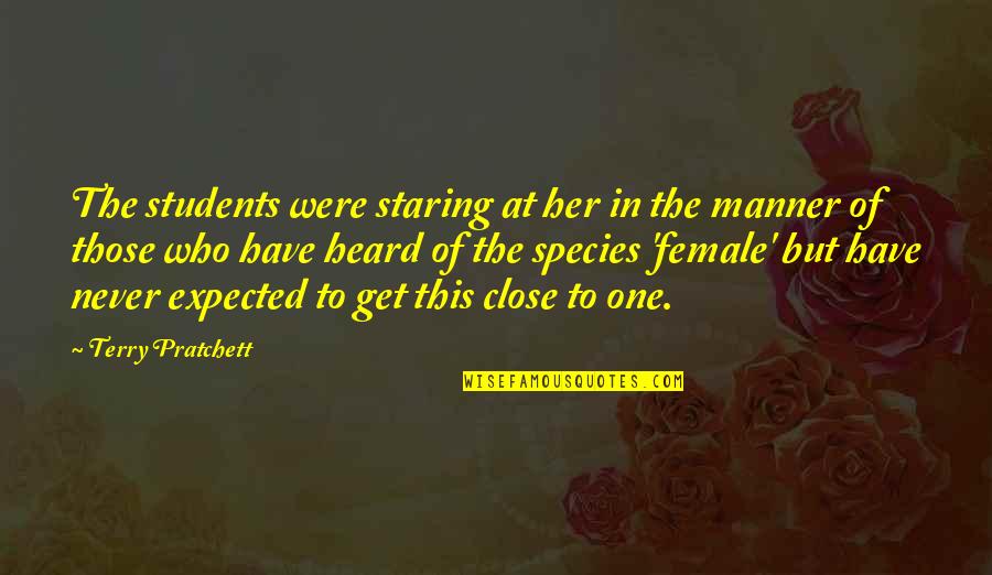 Female Species Quotes By Terry Pratchett: The students were staring at her in the
