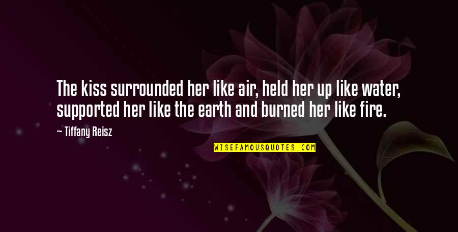 Fire And Earth Quotes By Tiffany Reisz: The kiss surrounded her like air, held her Fire And Earth Quotes By Tiffany Reisz: The kiss surrounded her like air, held her