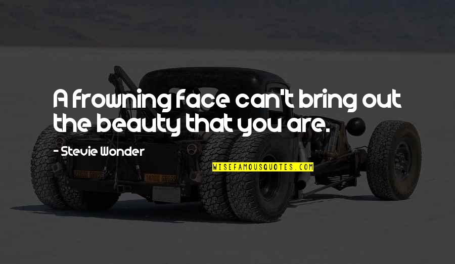 Frowning Quotes By Stevie Wonder: A frowning face can't bring out the beauty