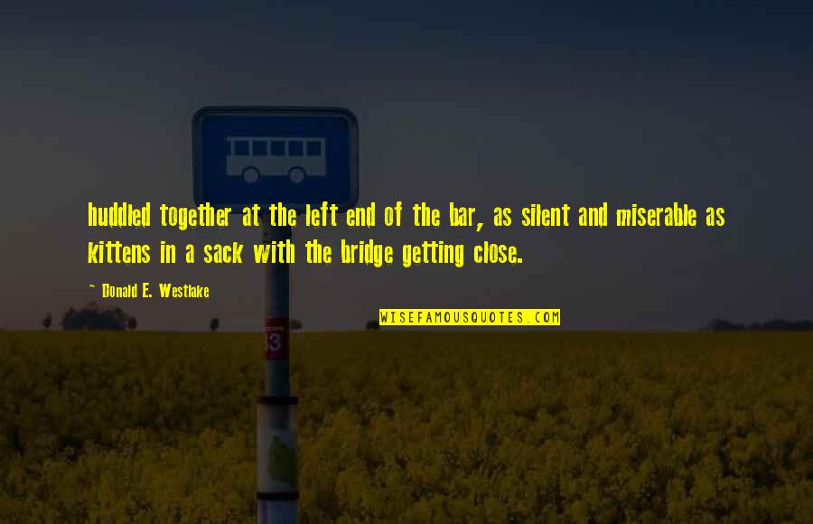 Getting Too Close Quotes By Donald E. Westlake: huddled together at the left end of the