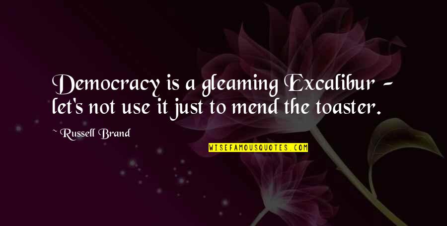 Ginty 7 Quotes By Russell Brand: Democracy is a gleaming Excalibur - let's not