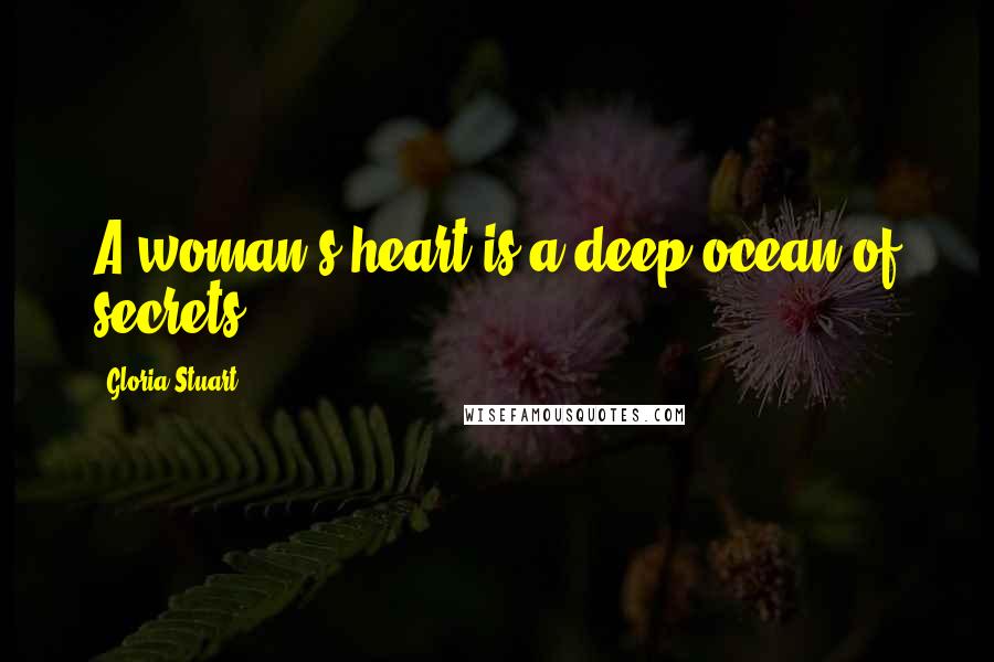 Gloria Stuart quotes: A woman's heart is a deep ocean of secrets.