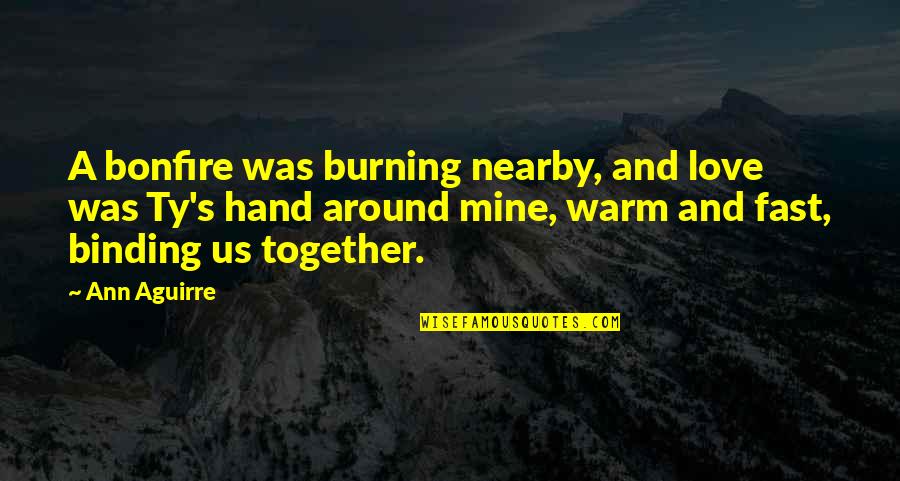 Greys Hvide Verden Quotes By Ann Aguirre: A bonfire was burning nearby, and love was Greys Hvide Verden Quotes By Ann Aguirre: A bonfire was burning nearby, and love was