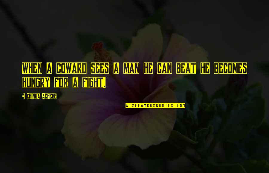 He A Coward Quotes By Chinua Achebe: When a coward sees a man he can