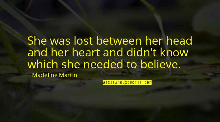 Heart And Head Quotes By Madeline Martin: She was lost between her head and her