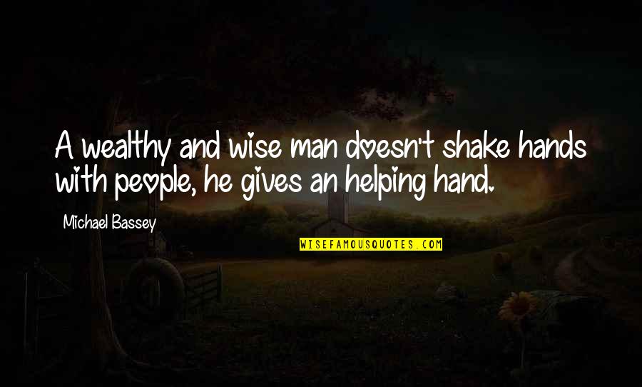 Helping Hand Quotes By Michael Bassey: A wealthy and wise man doesn't shake hands