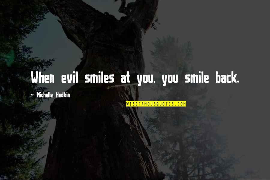 Heyers Walworth Quotes By Michelle Hodkin: When evil smiles at you, you smile back.