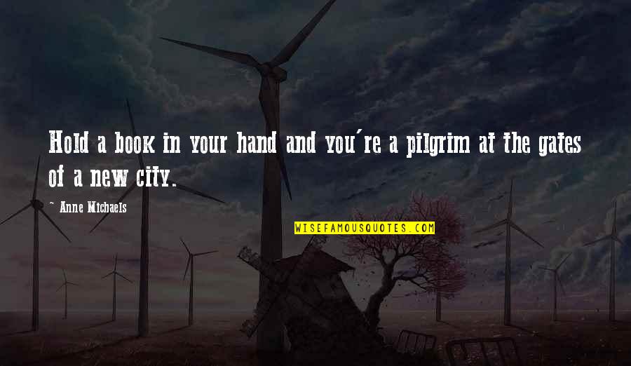 Hold The Hand Quotes By Anne Michaels: Hold a book in your hand and you're
