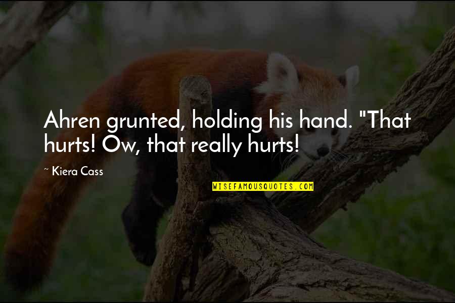 Holding Hand Quotes By Kiera Cass: Ahren grunted, holding his hand. "That hurts! Ow,