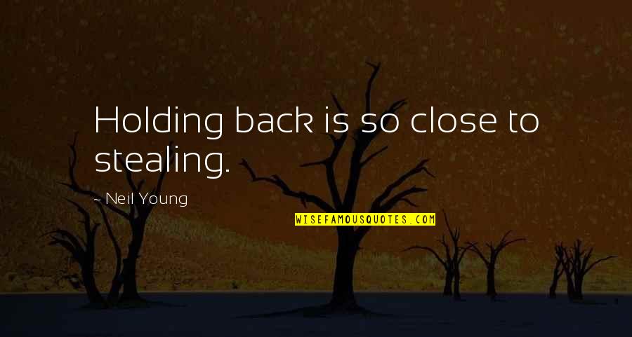 Holding You Close Quotes By Neil Young: Holding back is so close to stealing.