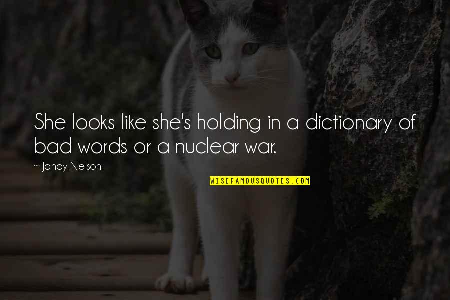 Holding Your Words Quotes By Jandy Nelson: She looks like she's holding in a dictionary