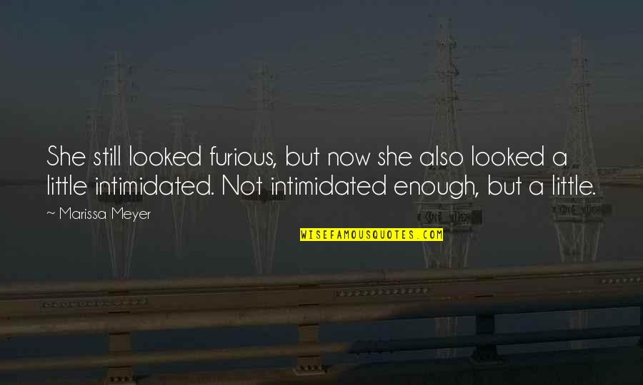 Ihlalli Quotes By Marissa Meyer: She still looked furious, but now she also Ihlalli Quotes By Marissa Meyer: She still looked furious, but now she also