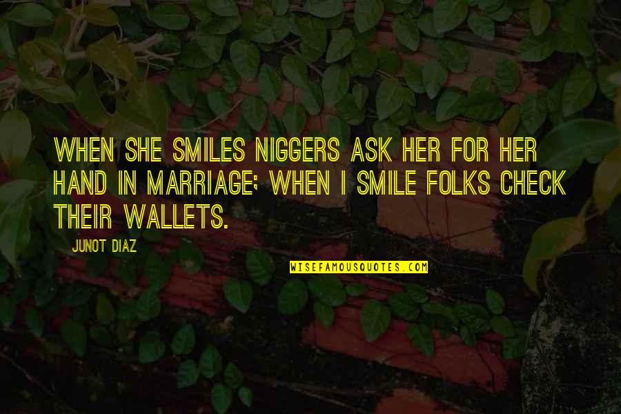 In Her Hand Quotes By Junot Diaz: When she smiles niggers ask her for her