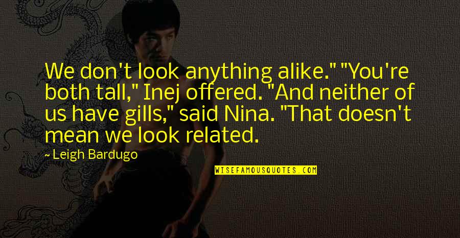 Inej And Nina Quotes By Leigh Bardugo: We don't look anything alike." "You're both tall," Inej And Nina Quotes By Leigh Bardugo: We don't look anything alike." "You're both tall,"
