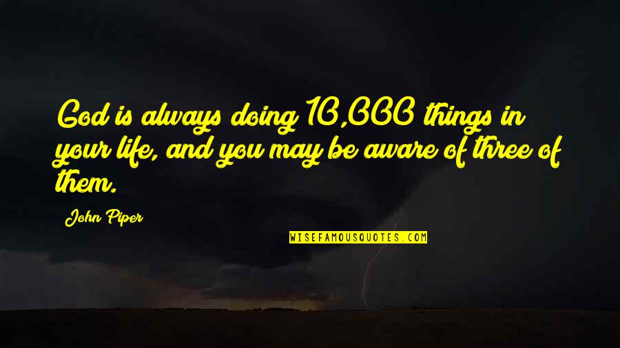 Interamnia Quotes By John Piper: God is always doing 10,000 things in your