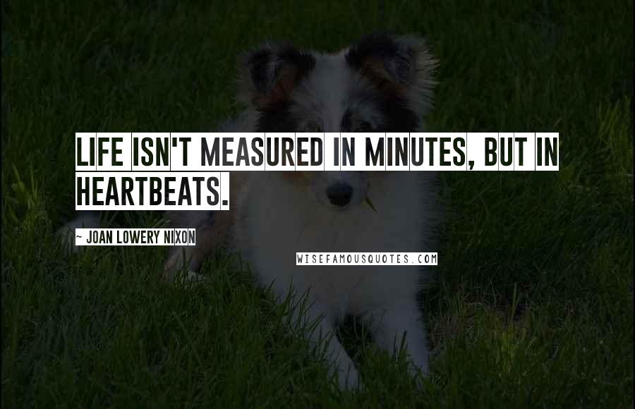 Joan Lowery Nixon quotes: Life isn't measured in minutes, but in heartbeats.