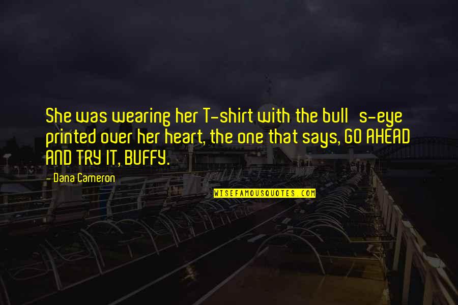 Karana Island Quotes By Dana Cameron: She was wearing her T-shirt with the bull's-eye