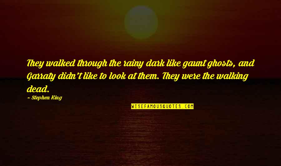 King Of The Dead Quotes By Stephen King: They walked through the rainy dark like gaunt