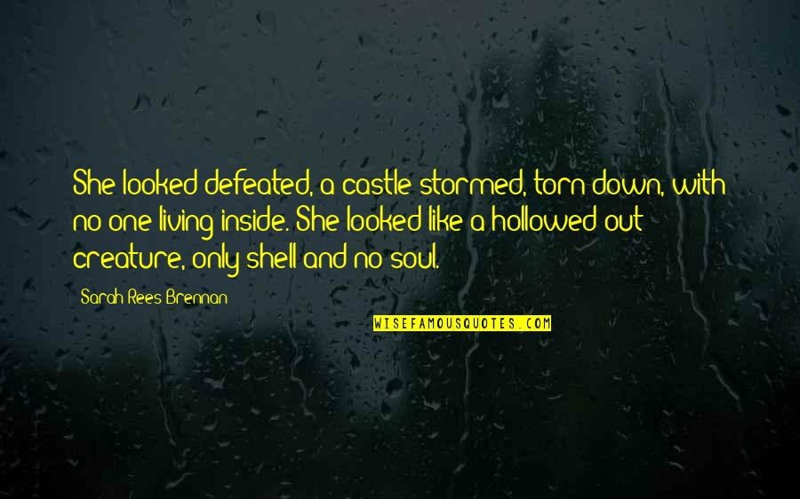 Latin Mottos And Quotes By Sarah Rees Brennan: She looked defeated, a castle stormed, torn down,