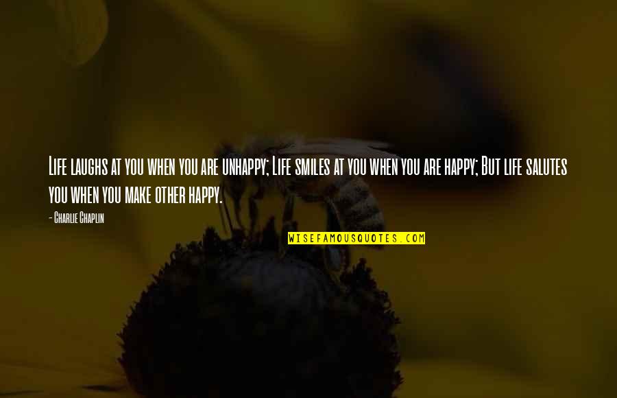 Laughs And Smiles Quotes By Charlie Chaplin: Life laughs at you when you are unhappy;