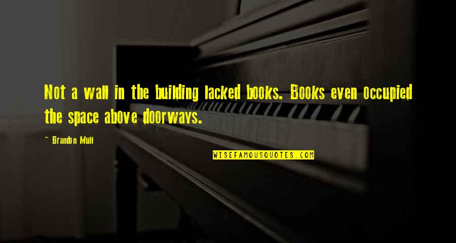 Learning Without Books Quotes By Brandon Mull: Not a wall in the building lacked books.