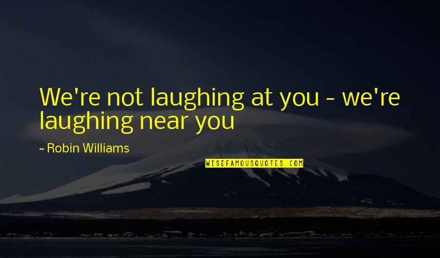 Leonide Lavaron Quotes By Robin Williams: We're not laughing at you - we're laughing