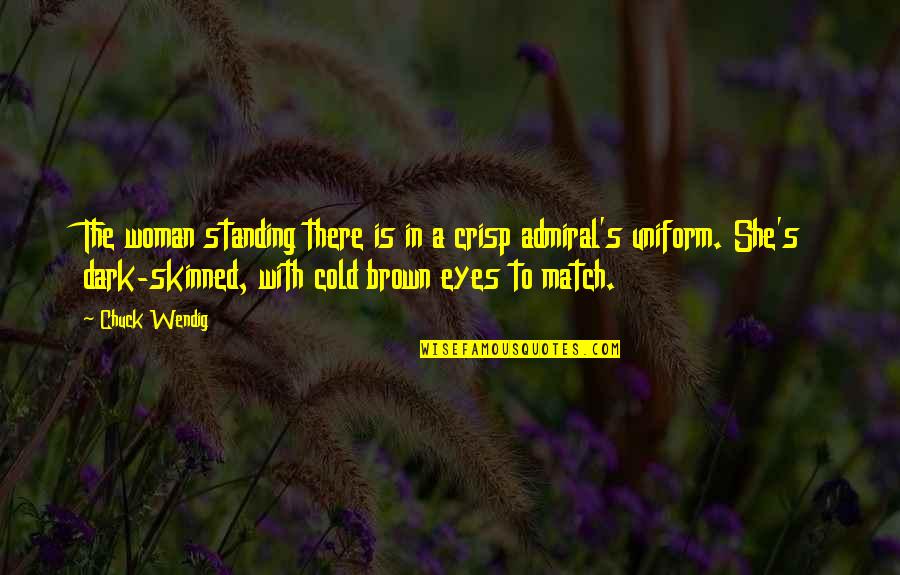 Liara T Soni Quotes By Chuck Wendig: The woman standing there is in a crisp Liara T Soni Quotes By Chuck Wendig: The woman standing there is in a crisp