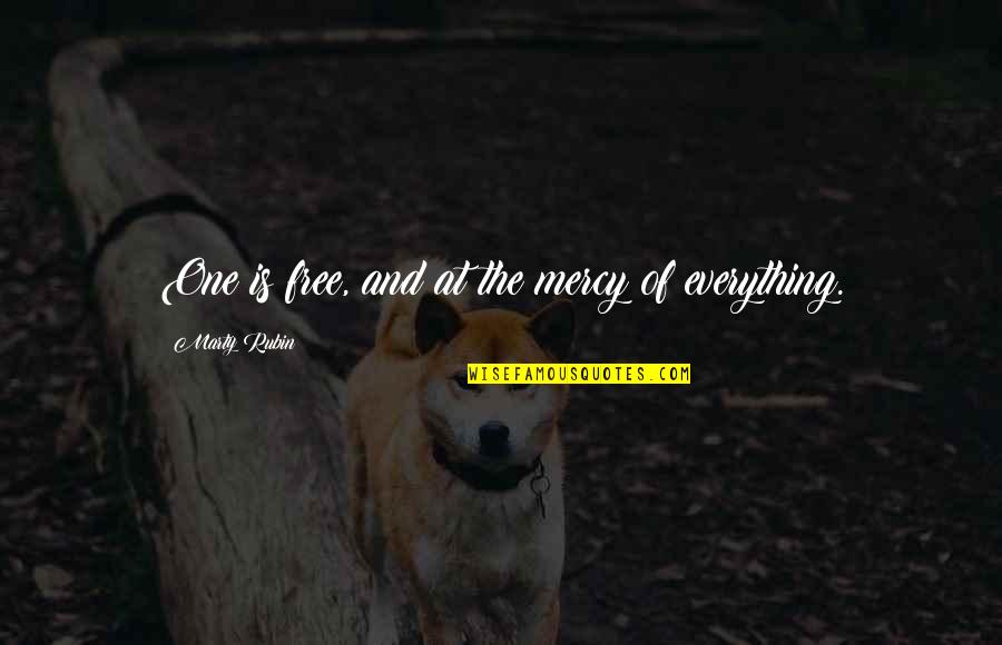 Living Life Carefree Quotes By Marty Rubin: One is free, and at the mercy of