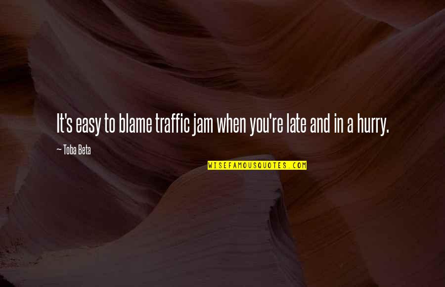 Living With A Wild God Quotes By Toba Beta: It's easy to blame traffic jam when you're