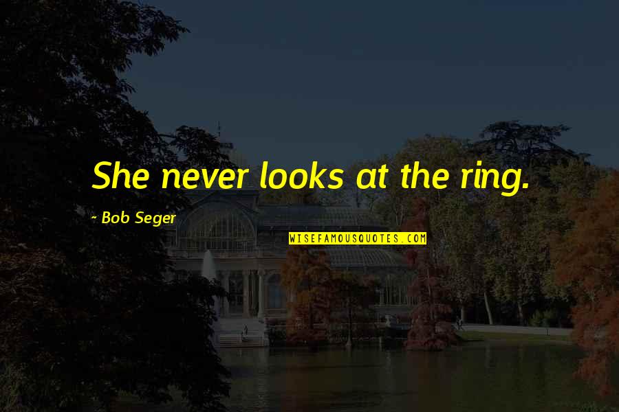 Mother To Her Son Quotes By Bob Seger: She never looks at the ring.