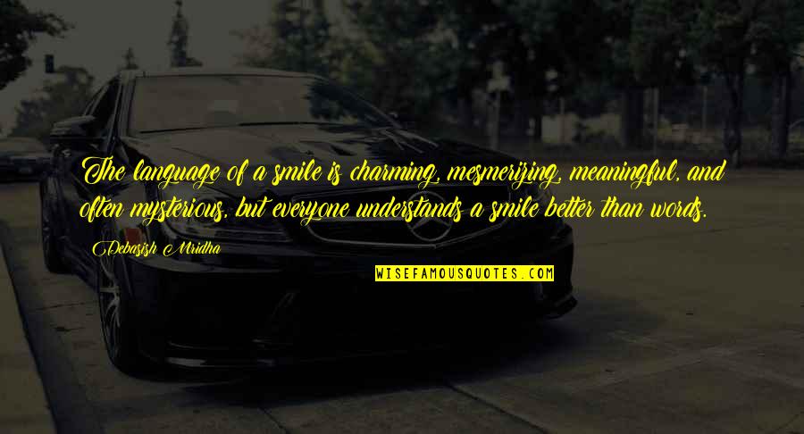 Not Everyone Understands Quotes By Debasish Mridha: The language of a smile is charming, mesmerizing,