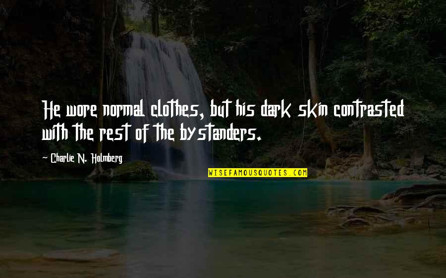 Owlets Facts Quotes By Charlie N. Holmberg: He wore normal clothes, but his dark skin Owlets Facts Quotes By Charlie N. Holmberg: He wore normal clothes, but his dark skin