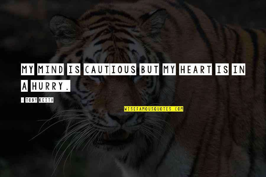 Potrzebujemy Quotes By Toby Keith: My mind is cautious but my heart is