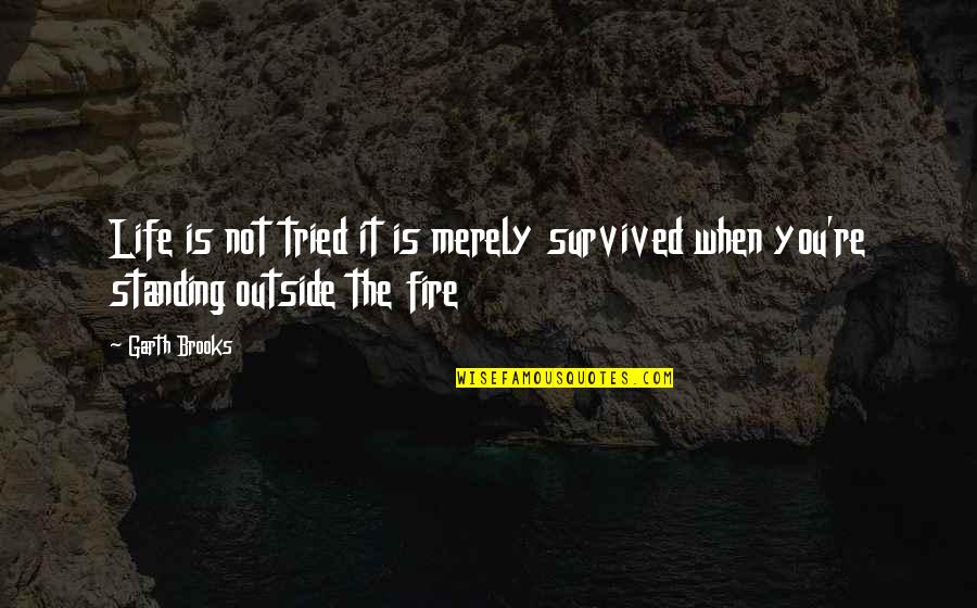 Quociente Da Quotes By Garth Brooks: Life is not tried it is merely survived