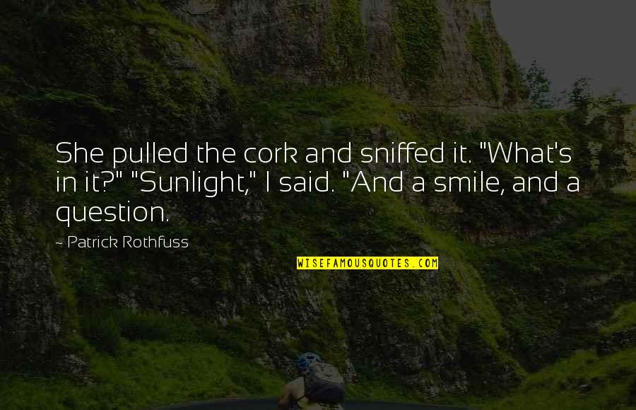 Randoview Quotes By Patrick Rothfuss: She pulled the cork and sniffed it. "What's Randoview Quotes By Patrick Rothfuss: She pulled the cork and sniffed it. "What's