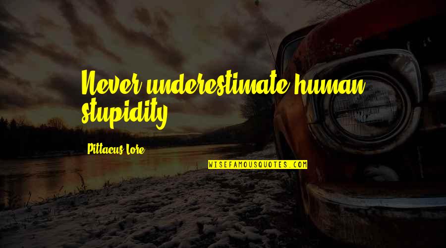 Retirement Banner Quotes By Pittacus Lore: Never underestimate human stupidity.