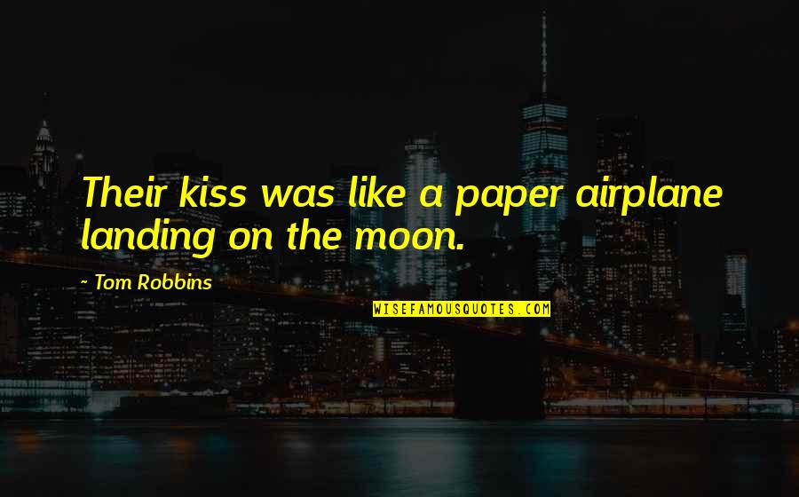 Robbins Quotes By Tom Robbins: Their kiss was like a paper airplane landing
