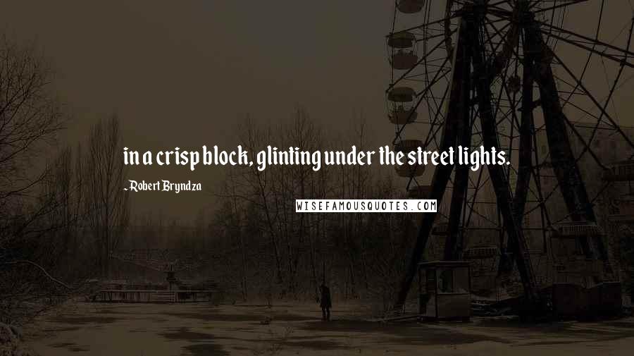 Robert Bryndza quotes: in a crisp block, glinting under the street lights.
