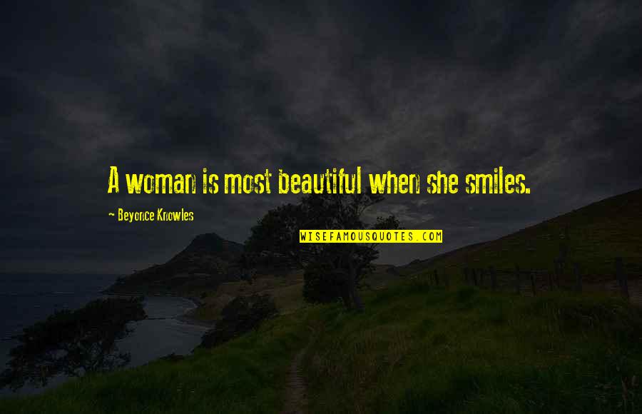 She Is Beautiful Quotes By Beyonce Knowles: A woman is most beautiful when she smiles.