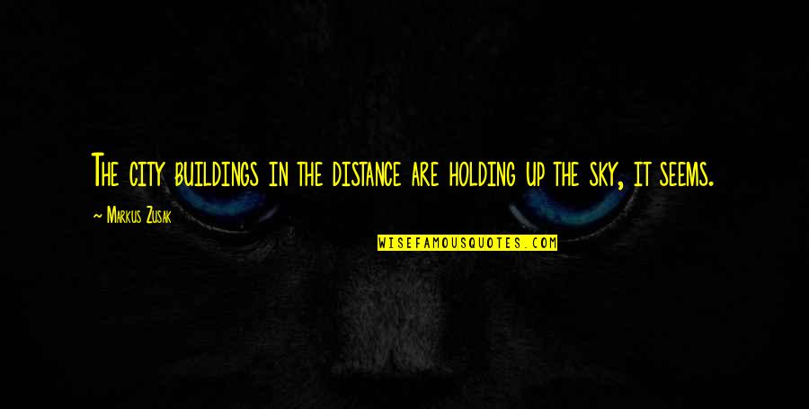 Sky And Buildings Quotes By Markus Zusak: The city buildings in the distance are holding