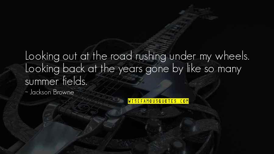 Smile Greeting Quotes By Jackson Browne: Looking out at the road rushing under my Smile Greeting Quotes By Jackson Browne: Looking out at the road rushing under my
