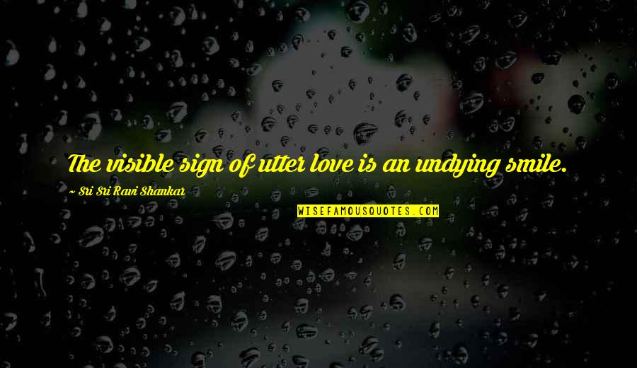 Smile Quotes By Sri Sri Ravi Shankar: The visible sign of utter love is an Smile Quotes By Sri Sri Ravi Shankar: The visible sign of utter love is an